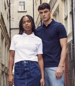 Just Polos AWDis Stretch Piqué Polo Shirt 32 Just Polos AWDis Stretch Piqué Polo Shirt -XAMAX jp002 whi model 1 1